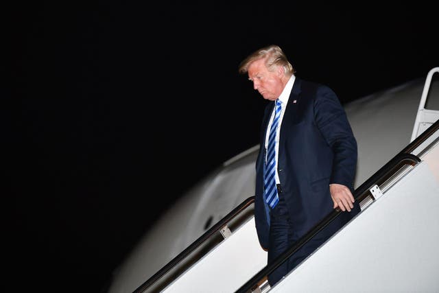 US President Donald Trump steps off Air Force One upon arrival at Andrews Air Force Base in Maryland on August 21, 2018