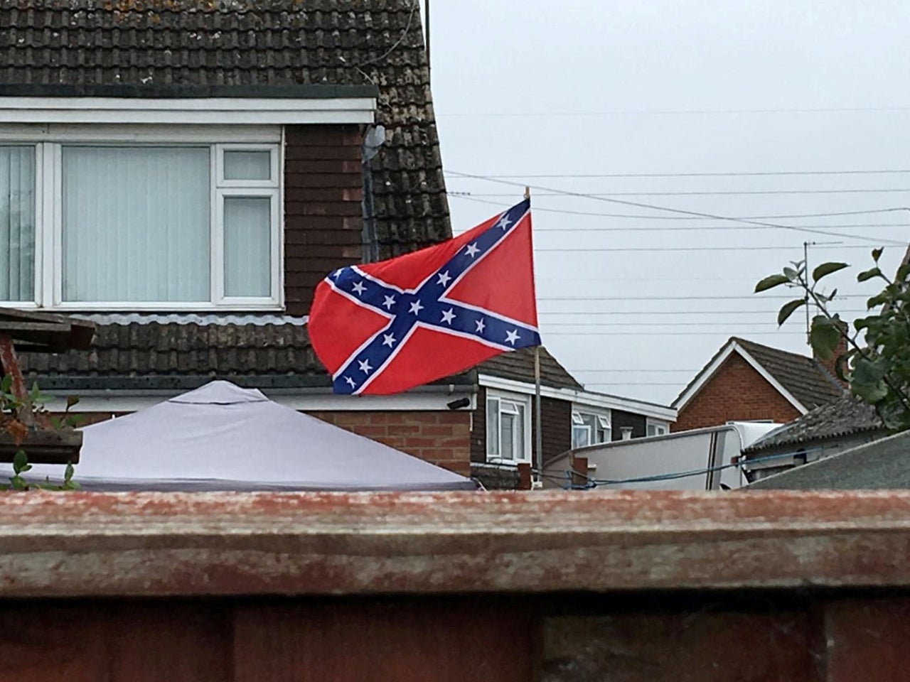 Man Forced To Take Down Racist Confederate Flag From Cheltenham Home The Independent The