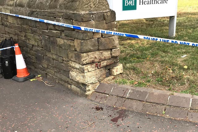 Blood was smeared on a door and on the pavement at the entrance to BMI The Huddersfield Hospital after a man was assaulted in a 'targeted attack' just after midnight on Wednesday