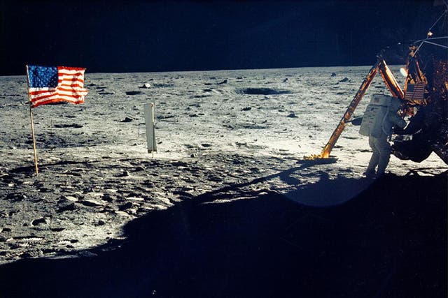 One of the few photographs of Neil Armstrong on the moon shows him working on his space craft on the lunar surface