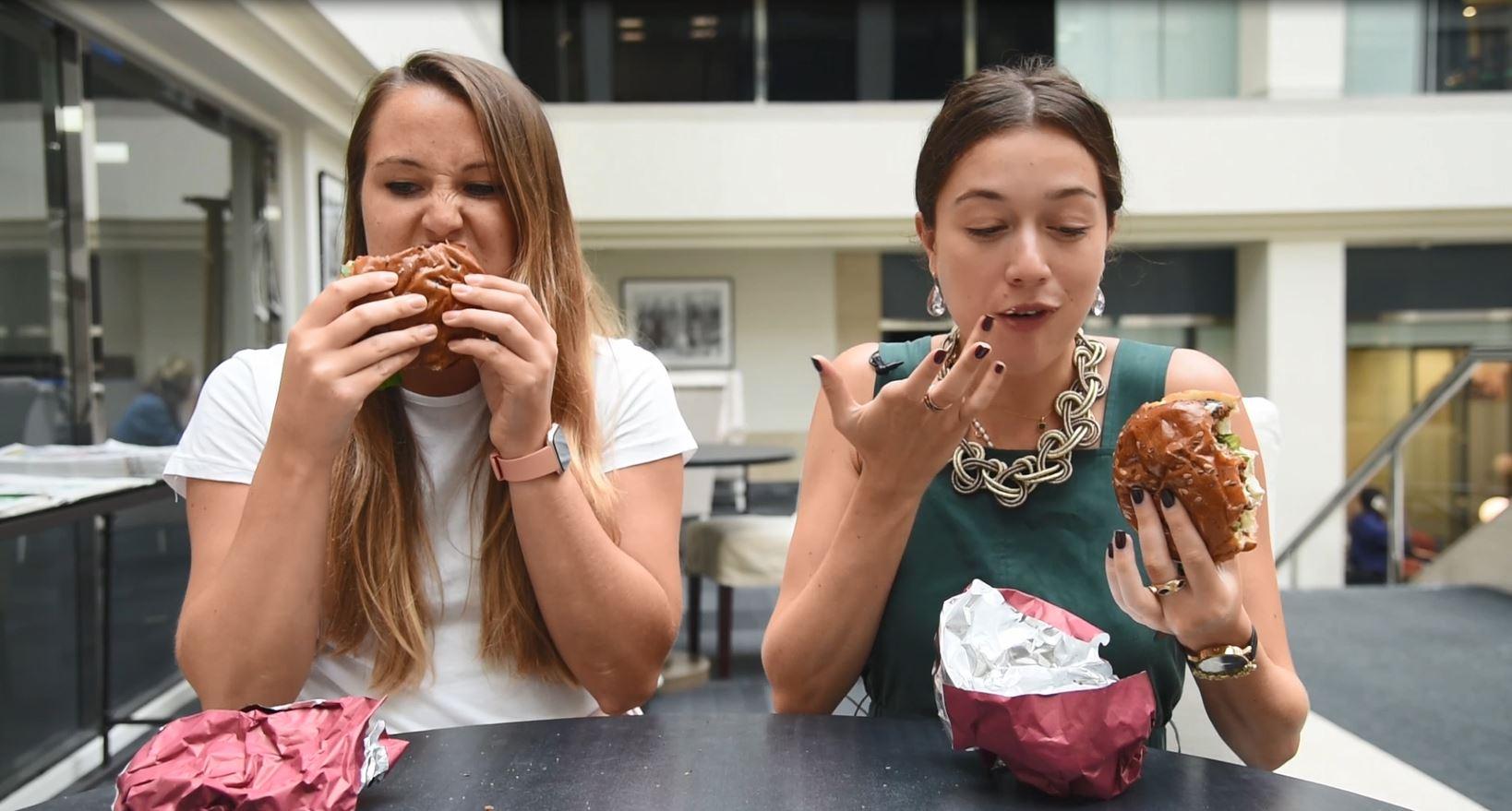 Olivia and Rachel tucking into the vegan burgers