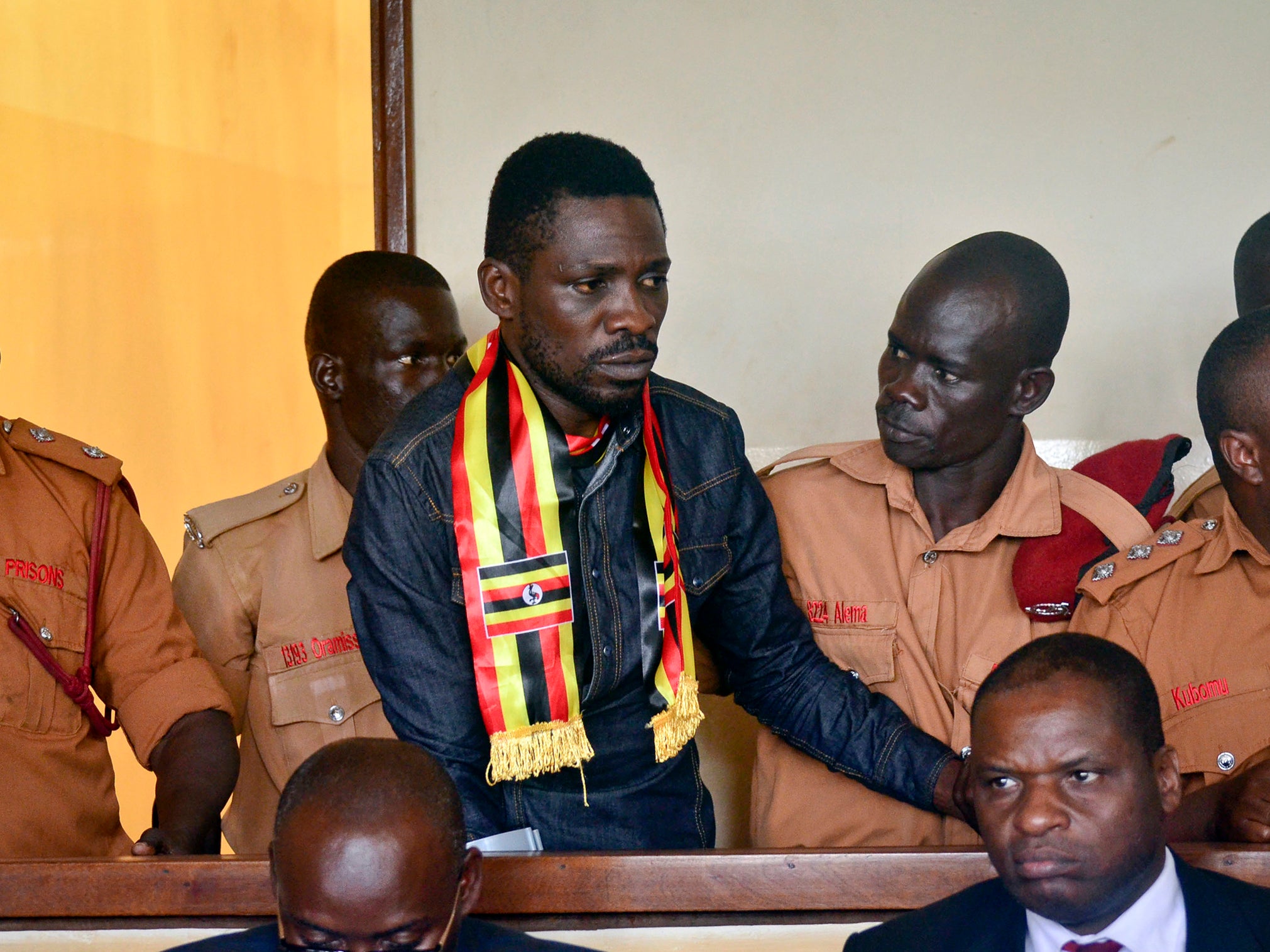 Robert Ssentamu limped during his appearance in military court and appeared to cry as he rubbed his eyes