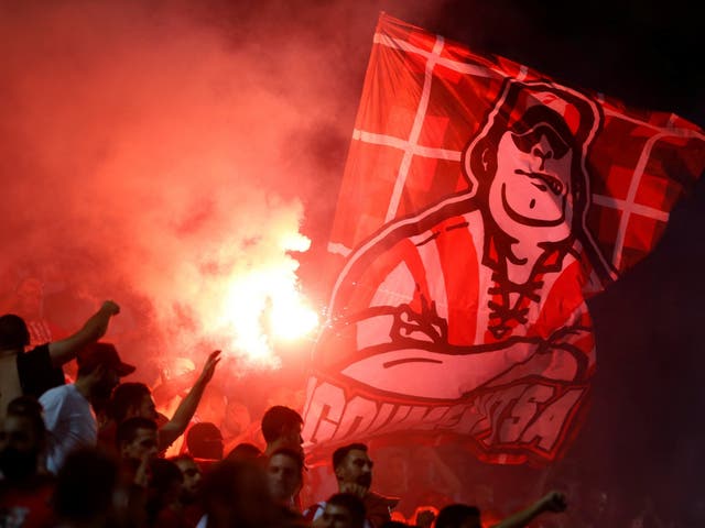 Olympiacos fans with a flare