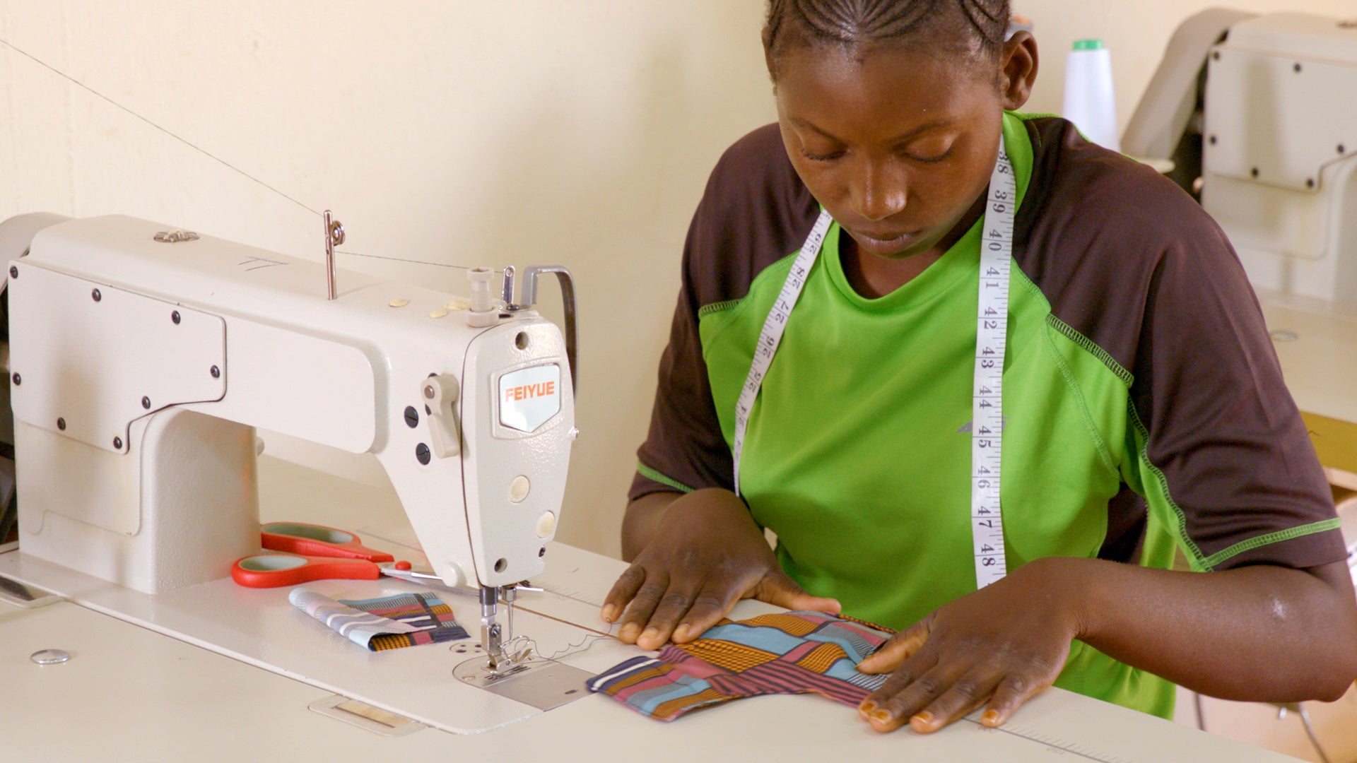 A seamstress creating sanitary pads for girls in Kenya