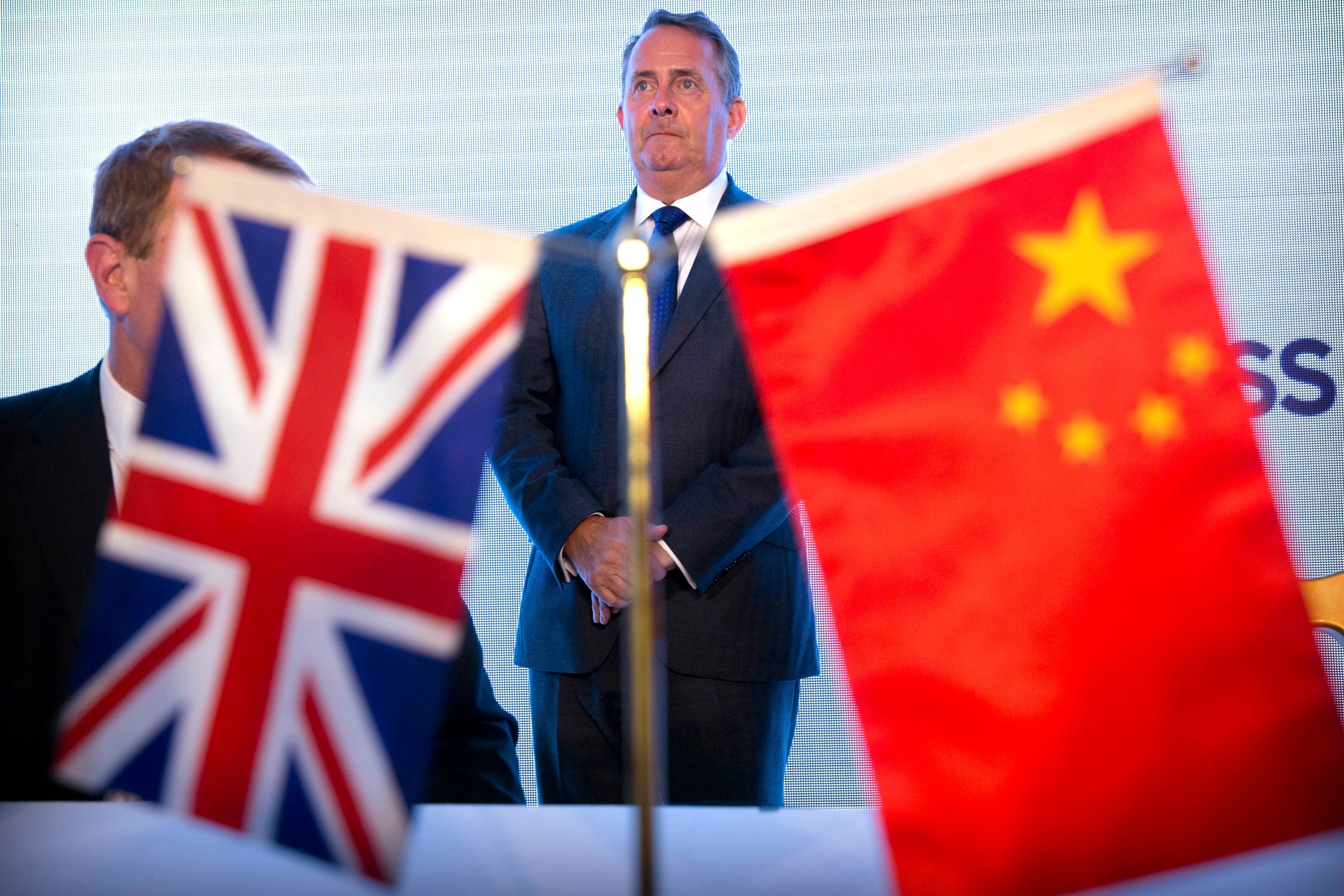 Liam Fox attends a ceremony in Beijing on Friday