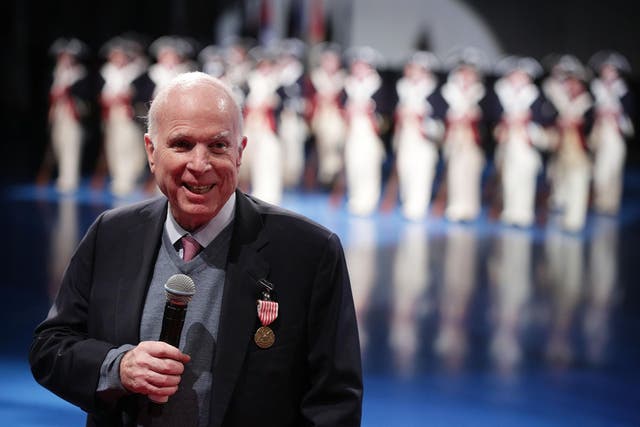 US Senator John McCain speaks after he was presented with the Outstanding Civilian Service Medal