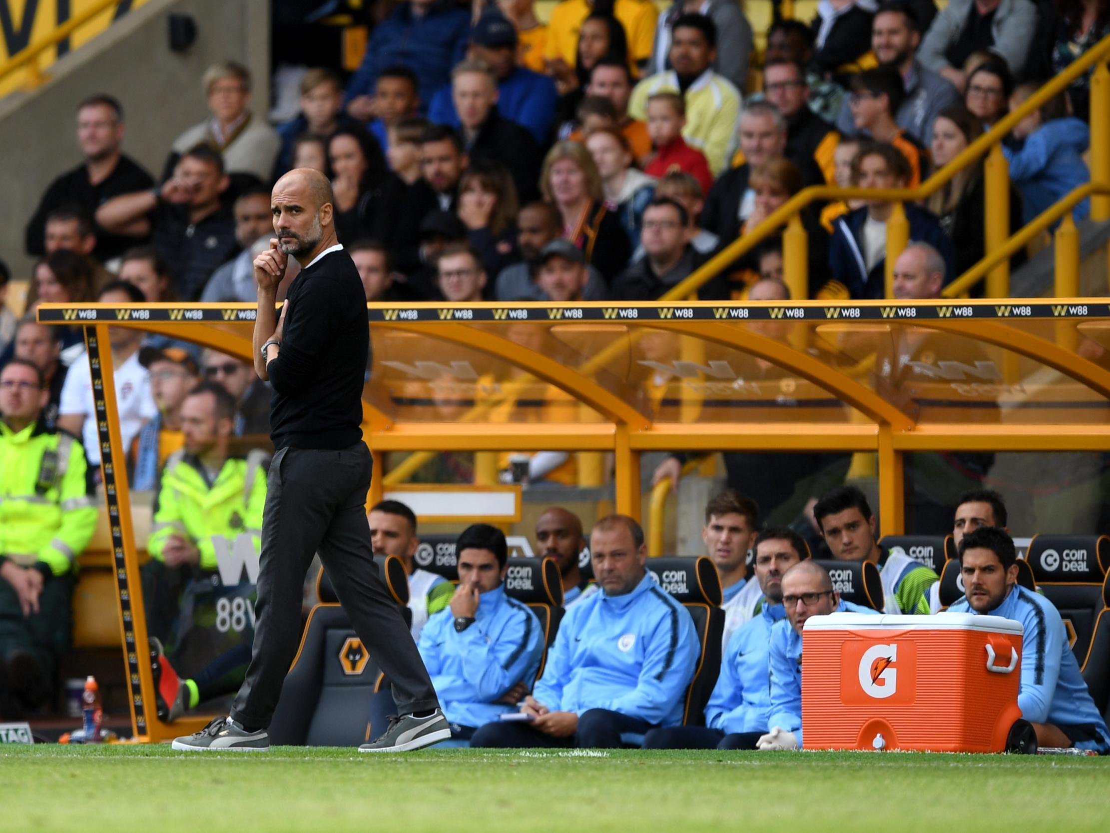 Pep Guardiola watches on anxiously from the sidelines