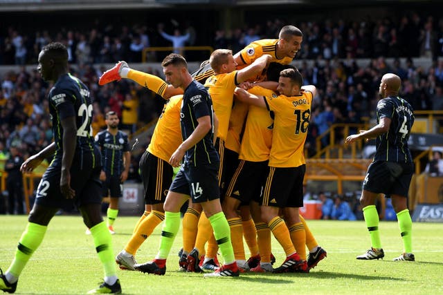 Wolves celebrate Willy Boly's goal - though hosts failed to spot the player's handling of the ball