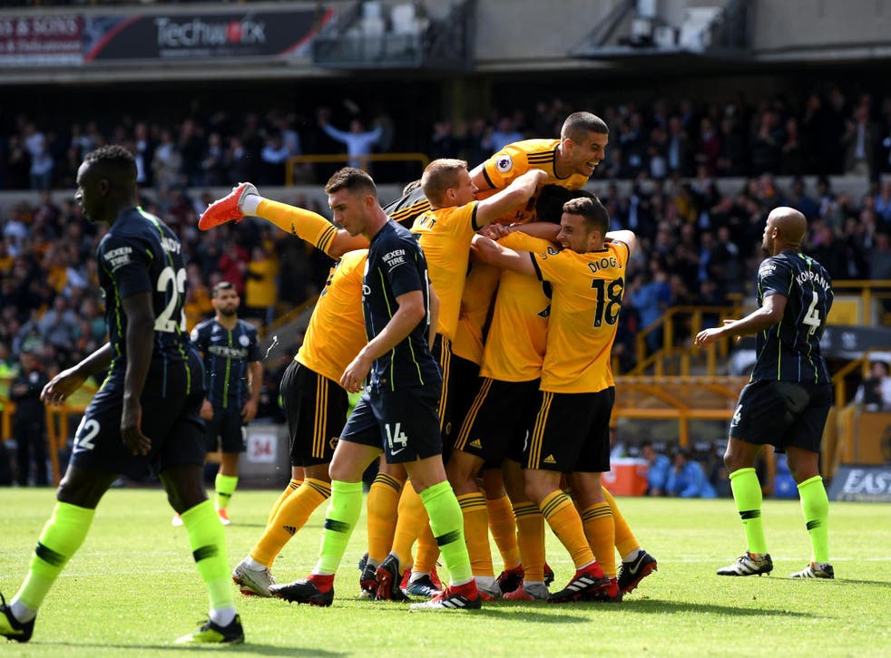 Wolves celebrate Willy Boly's goal - though hosts failed to spot the player's handling of the ball