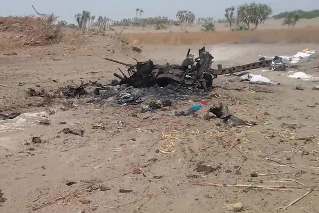 The wreck of a vehicle at the scene of an airstrike which allegedly hit a car carrying displaced people, killing women and children fleeing fighting in Al Durayhimi district