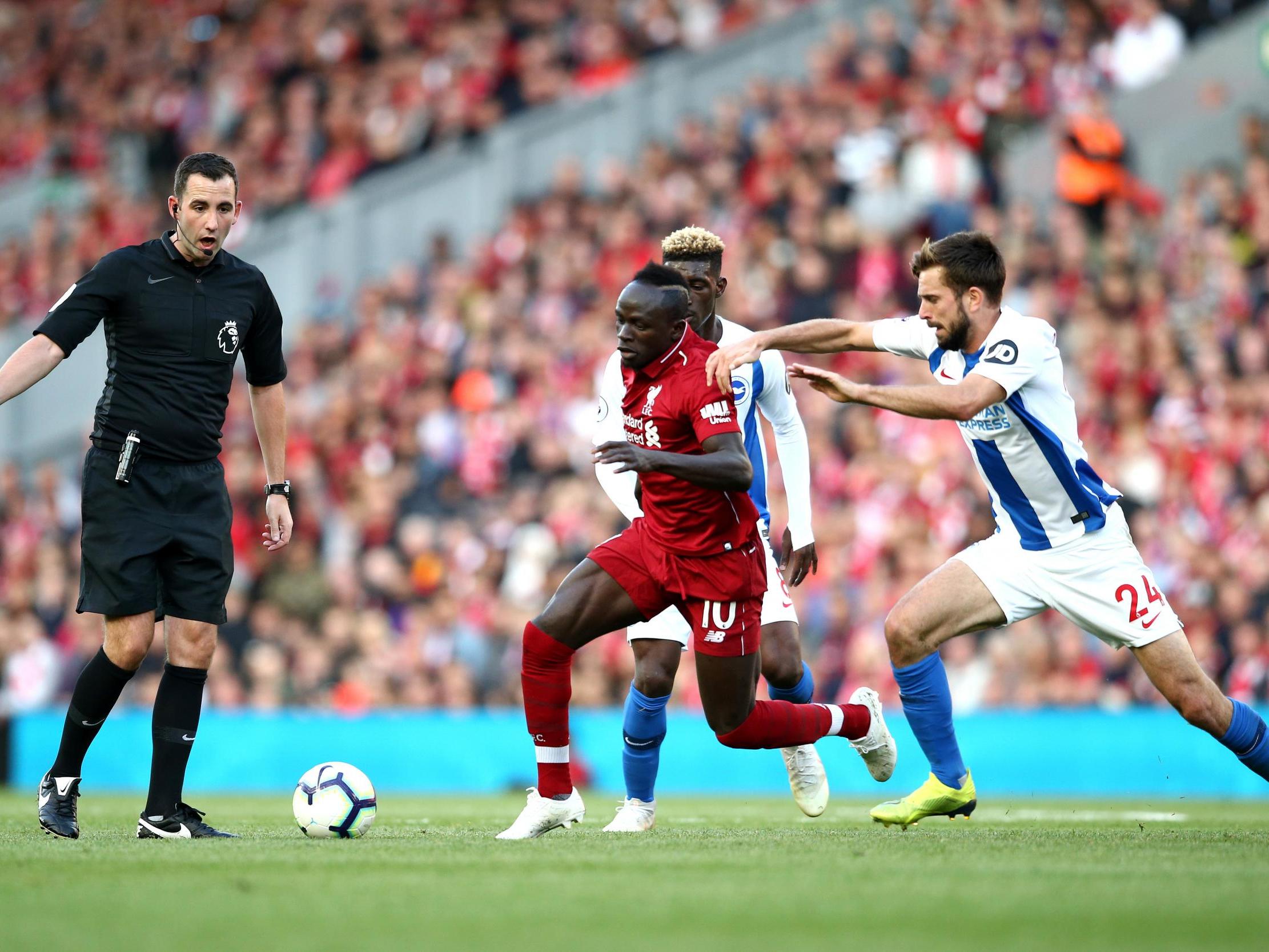Sadio Mane attempts to get away from Yves Bissouma and Davy Proepper