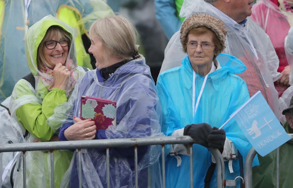 Hundreds of people, some of whom arrived as early as 6am, could be seen wearing waterproof ponchos and holding umbrellas at Knock in Co Mayo ahead of the Pope's arrival