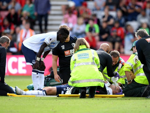 Michael Keane of Everton receives medical treatment