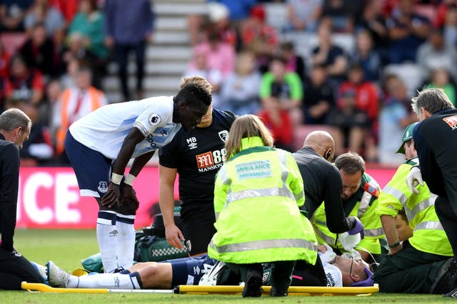 Michael Keane of Everton receives medical treatment