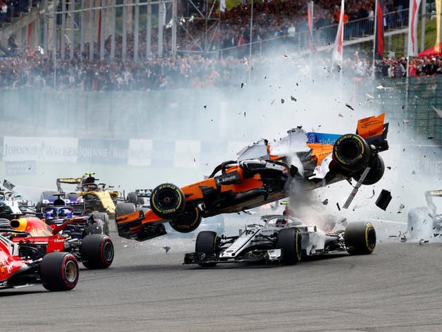 McLaren's Fernando Alonso and Sauber's Charles Leclerc crash at the first corner