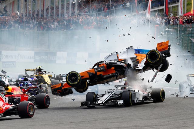 McLaren's Fernando Alonso and Sauber's Charles Leclerc crash at the first corner