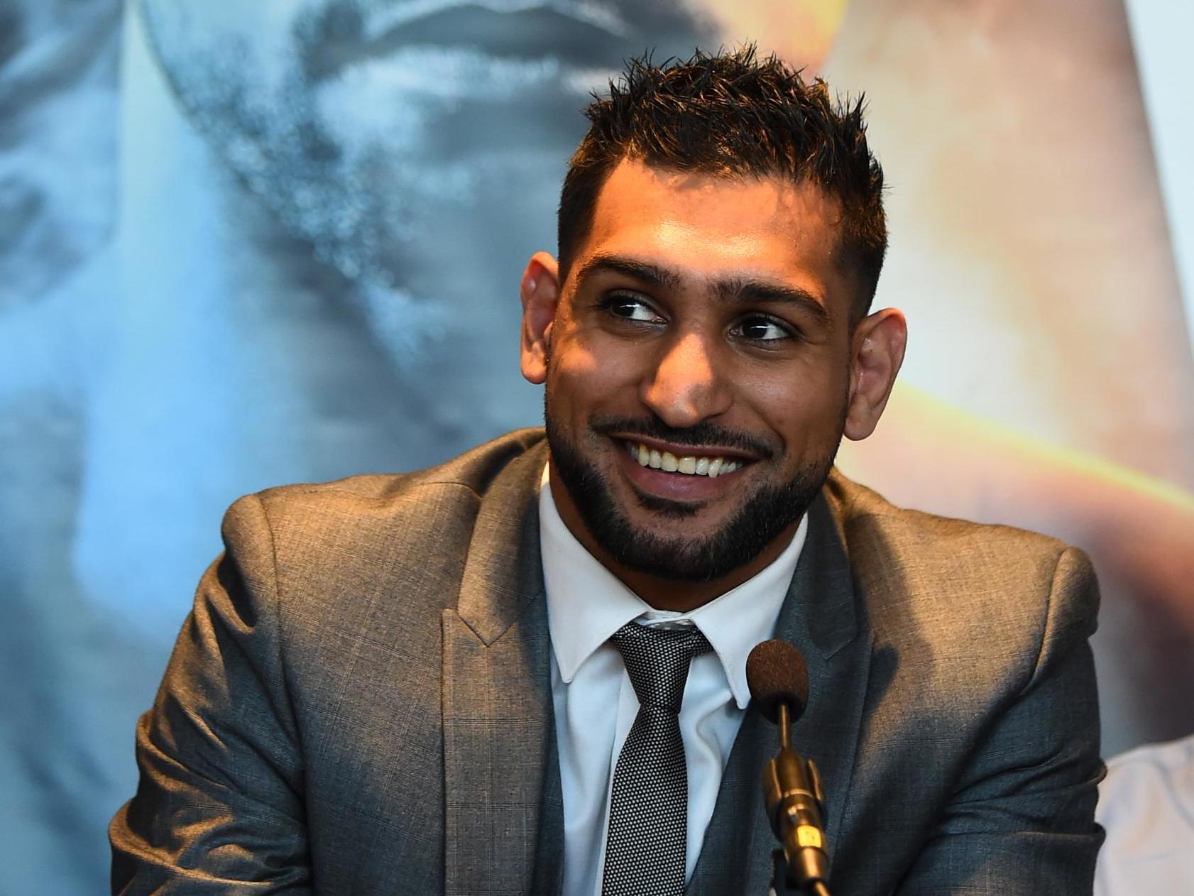 Amir Khan talks to the media during a press conference