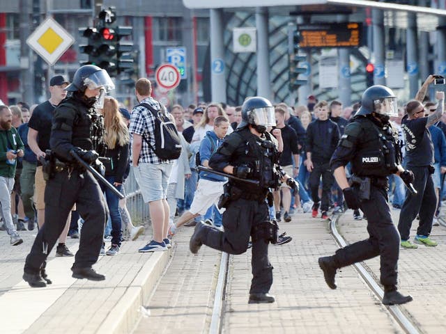 Riot police cross the street in Chemnitz, eastern Germany