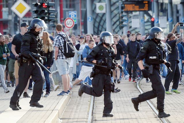 Riot police cross the street in Chemnitz, eastern Germany