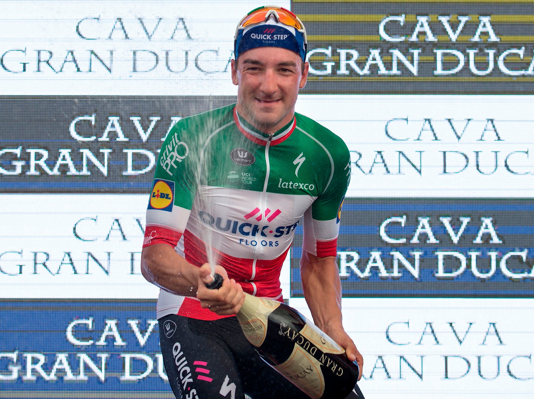 Quick - Step Floors' Italian cyclist Elia Viviani sprays some Cava