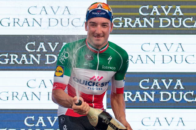 Quick - Step Floors' Italian cyclist Elia Viviani sprays some Cava
