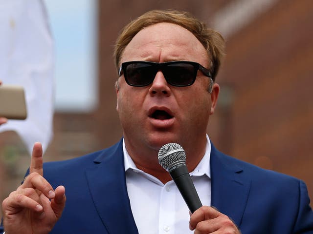 Alex Jones speaks during a rally in support of Donald Trump