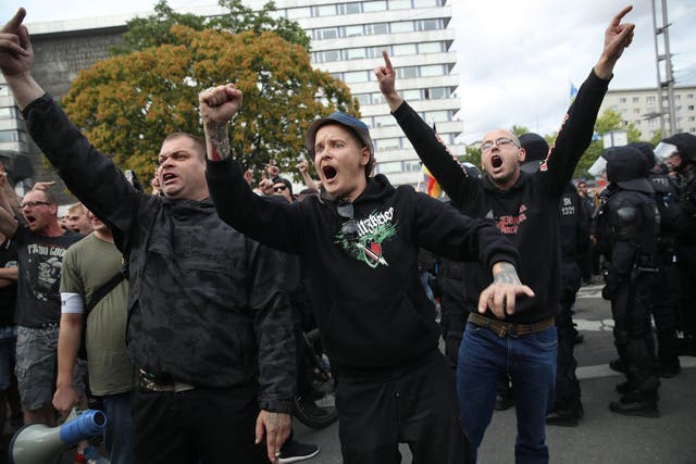 Far-right supporters chant at anti-fascist rivals in Chemnitz, Saxony