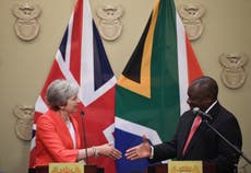 May claims trade success in Africa – but critics protest at 'rollover'