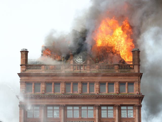 Flames billow from the top of Primark's Belfast store