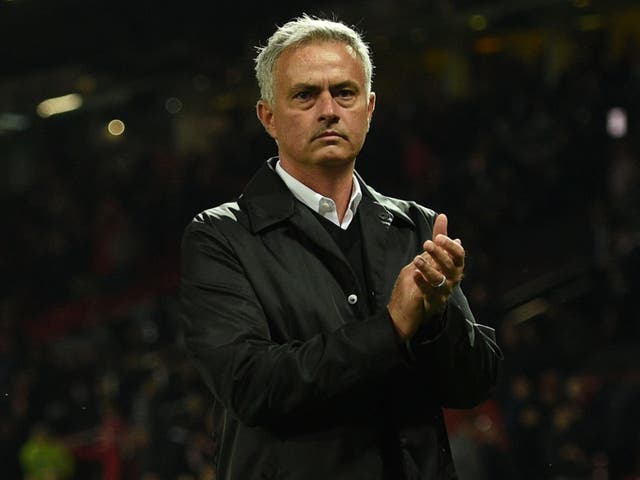 Manchester United's Jose Mourinho stands on the pitch