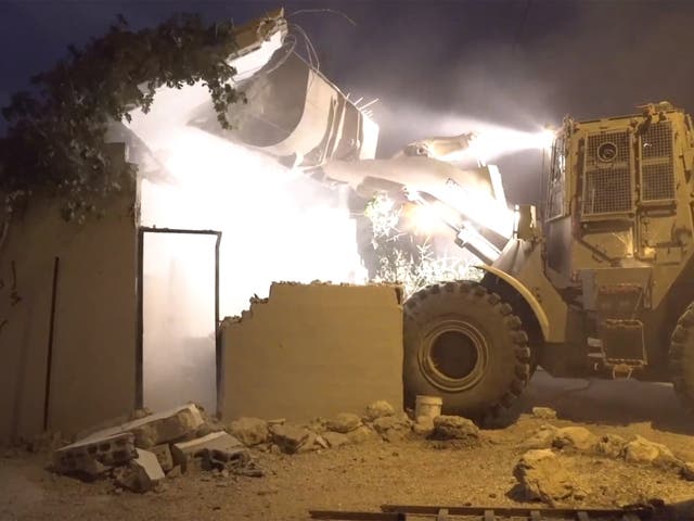 An Israeli bulldozer destroys the West Bank home of a Palestinian who stabbed to death an Israeli citizen
Image: Israeli army