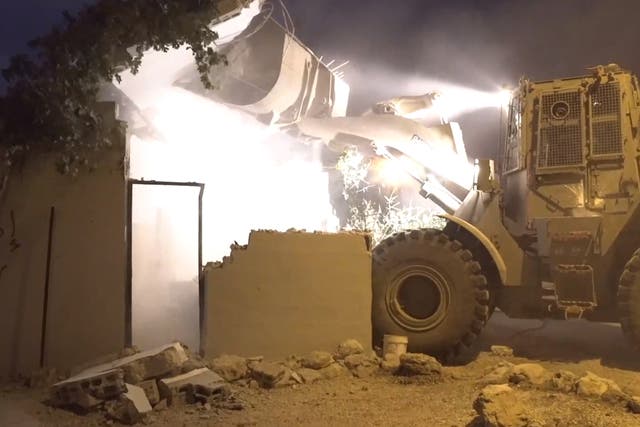 An Israeli bulldozer destroys the West Bank home of a Palestinian who stabbed to death an Israeli citizen
Image: Israeli army
