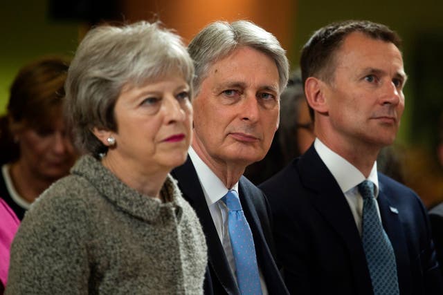 Theresa May with Philip Hammond: 'Crashing out of the EU next March is a bit more serious than the prime minister breezily implies'