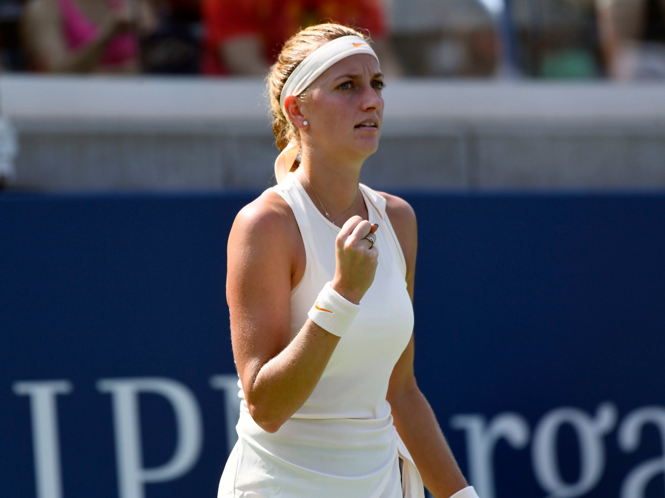 Petra Kvitova celebrates clinching the first set (USA Today Sports)