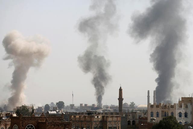 Smoke rises from the site of Saudi-led air strikes in Sana’a