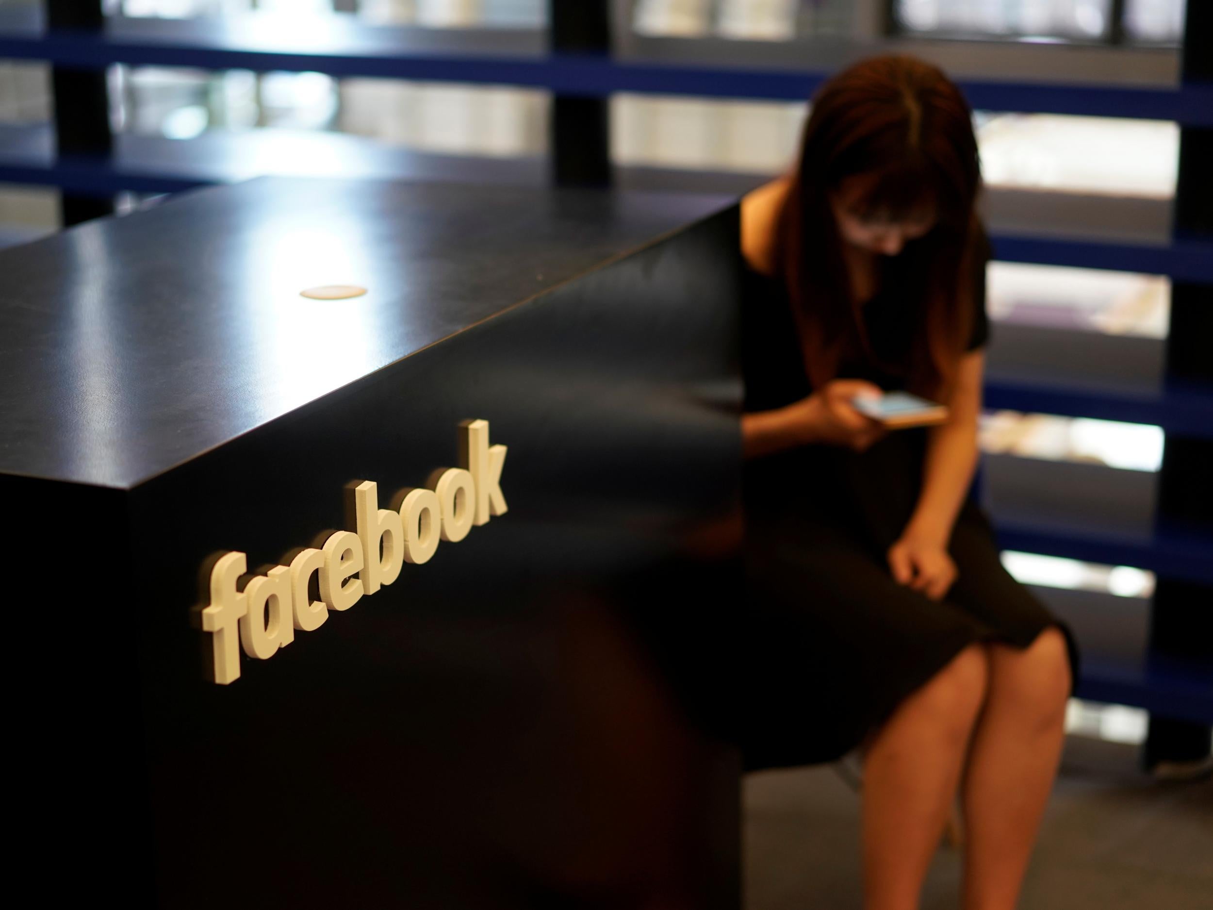 A Facebook sign is seen during the China Digital Entertainment Expo and Conference, 3 August 2018