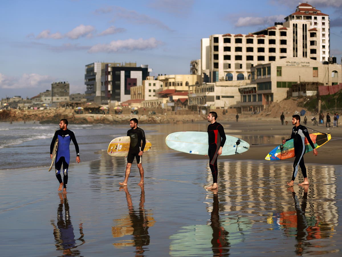 In a place where surfboards are illegal, a surf club in Gaza has had to  improvise | The Independent | The Independent