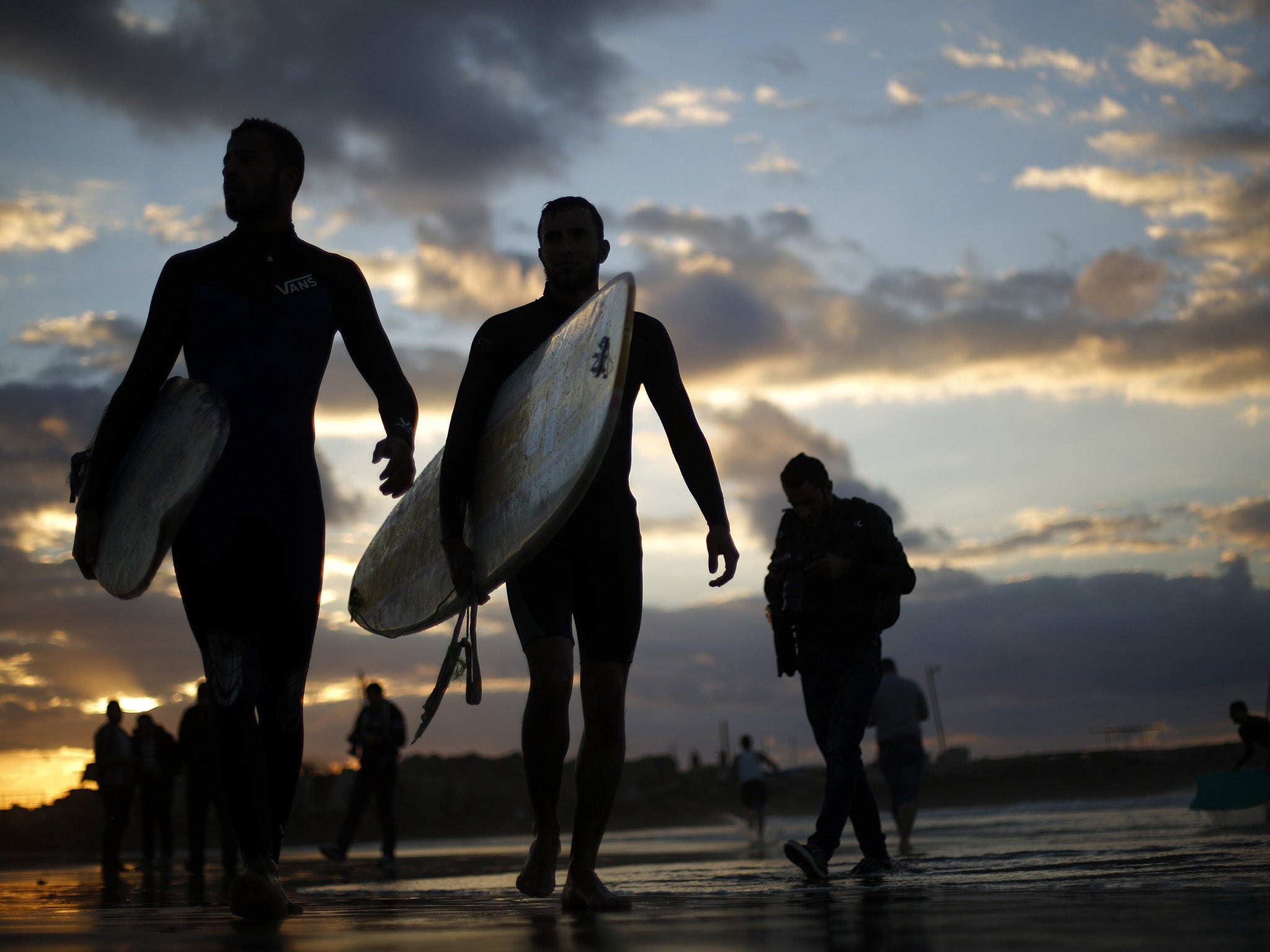 In a place where surfboards are illegal, a surf club in Gaza has had to  improvise | The Independent | The Independent