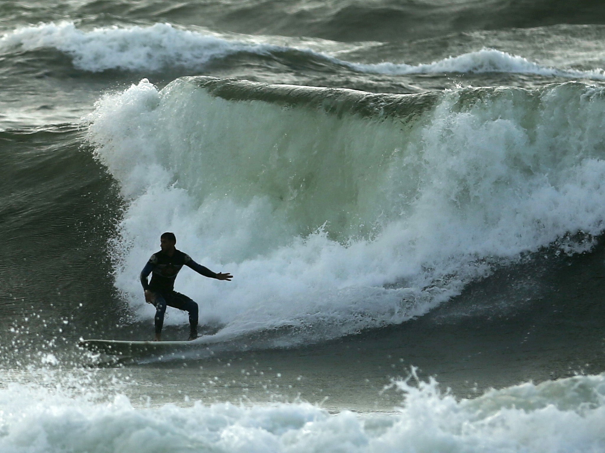 In a place where surfboards are illegal, a surf club in Gaza has had to  improvise | The Independent | The Independent