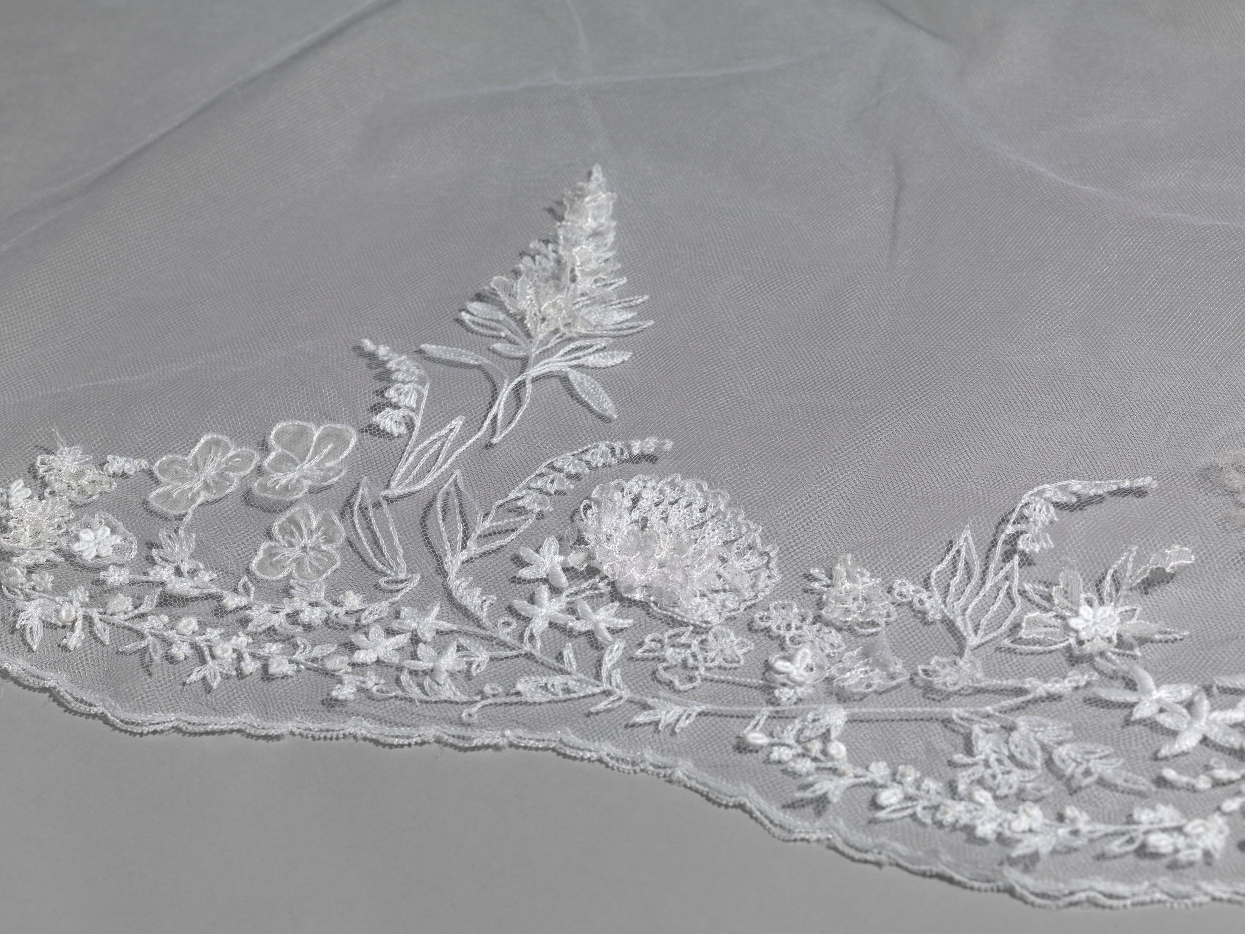 Detail of The Duchess of Sussex's wedding veil. The five-metre-long veil is made from silk-tulle and embroidered with the flora of the 53 countries of the Commonwealth