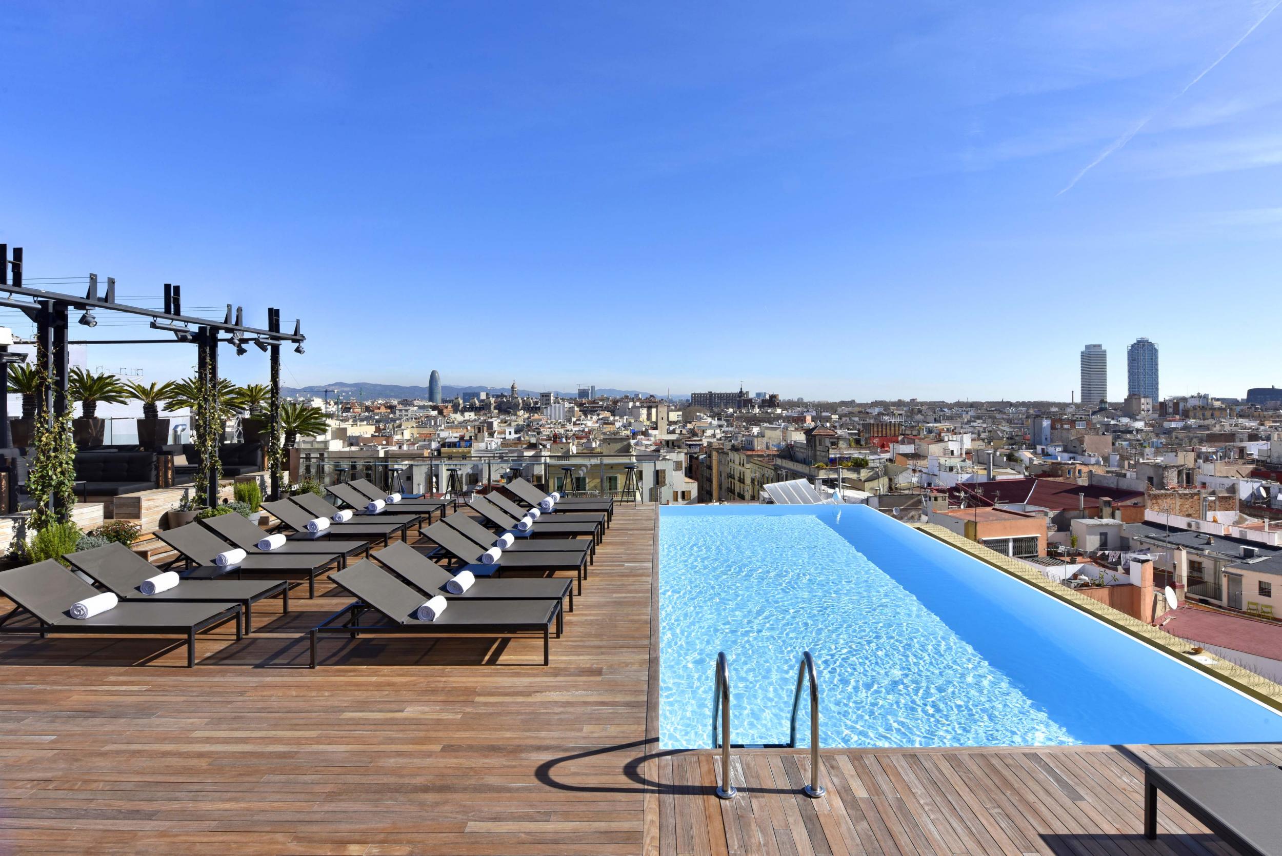 Take in the views from the Grand Hotel's rooftop infinity pool