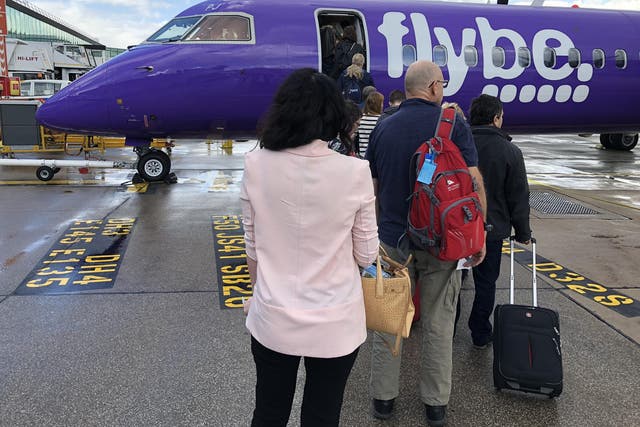Escape route: A Flybe flight prepares to leave Manchester Airport for Edinburgh on 24 August 2018, the airport's busiest day of the summer so far
