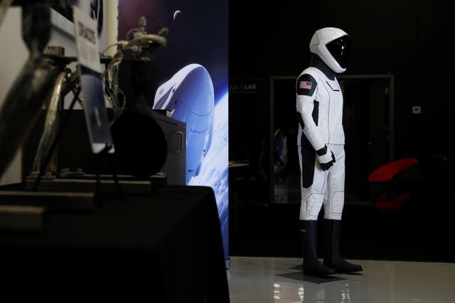 SpaceX shows its new spacesuit that will be worn by NASA astronauts during their first spaceflights in the Crew Dragon spacecraft during a visit to SpaceX headquarters in Hawthorne, California