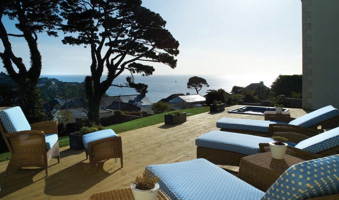 Breathe in the sea air on the terrace at the Fowey Hall Hotel