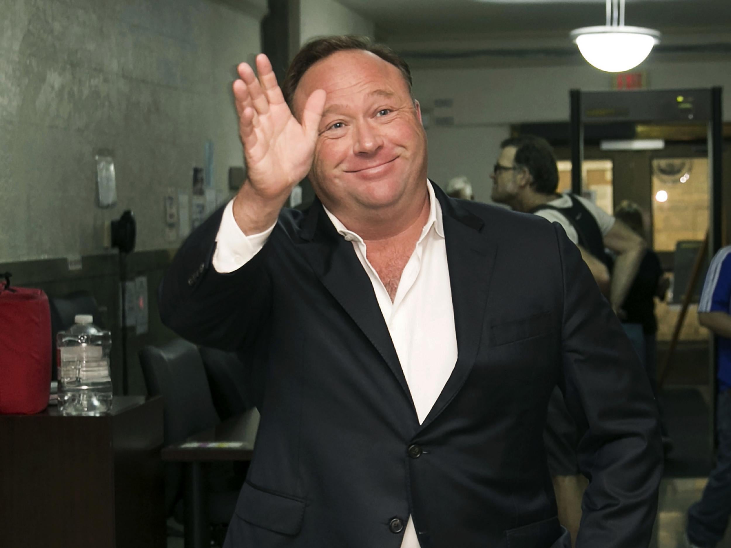 Alex Jones, a right-wing radio host and conspiracy theorist, arrives at the courthouse in Austin, Texas. A judge has denied conspiracy theorist Jones' request Wednesday, Aug. 29, 2018, to dismiss a lawsuit surrounding the 2012 Sandy Hook Elementary School massacre that he has called a hoax.