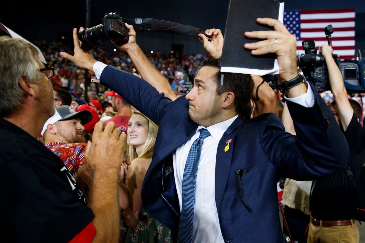 Trump Indiana rally: Volunteer tries to block news photographer from ...