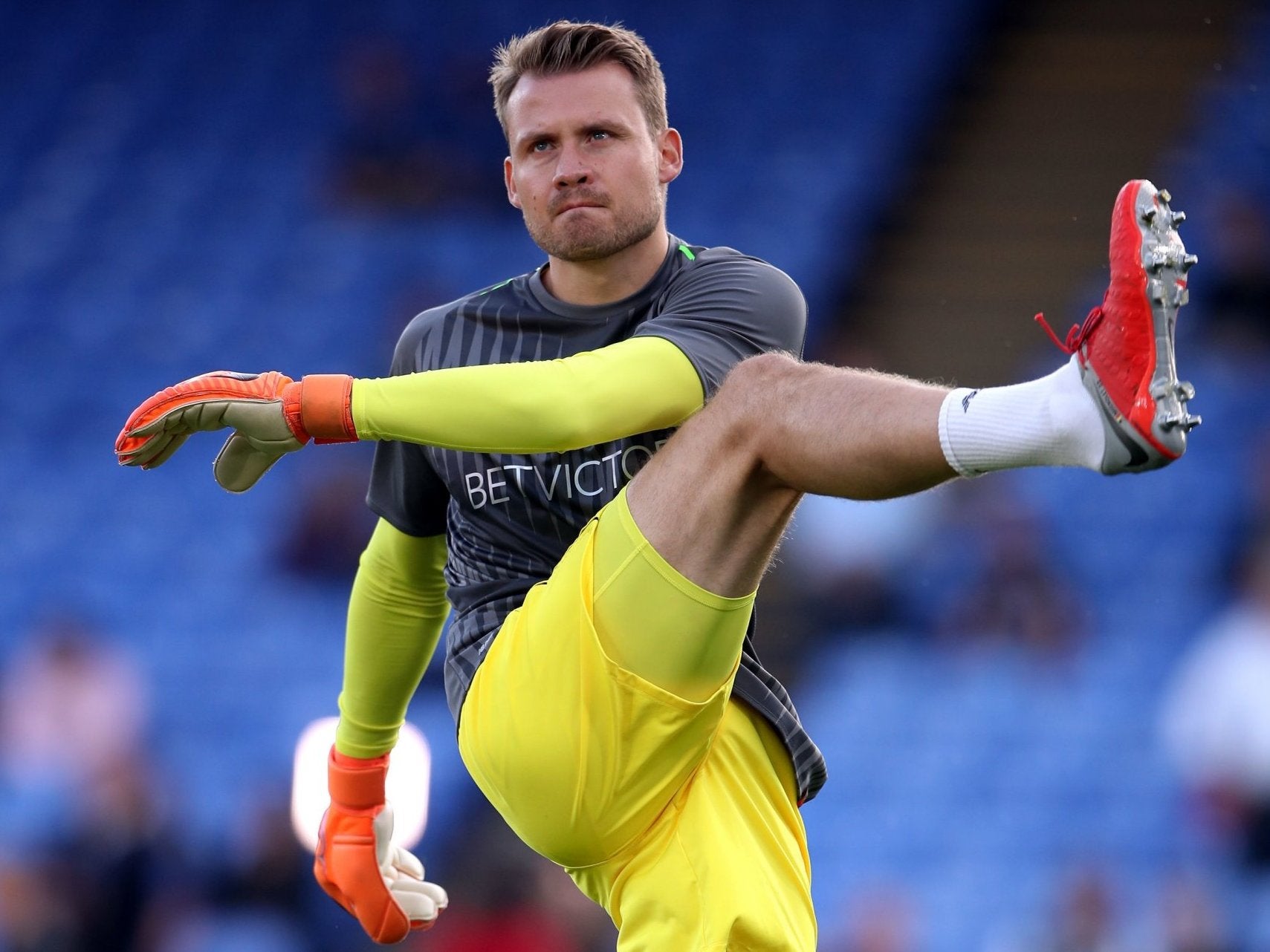 Liverpool goalkeeper Simon Mignolet warms up
