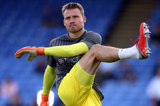 Liverpool goalkeeper Simon Mignolet warms up