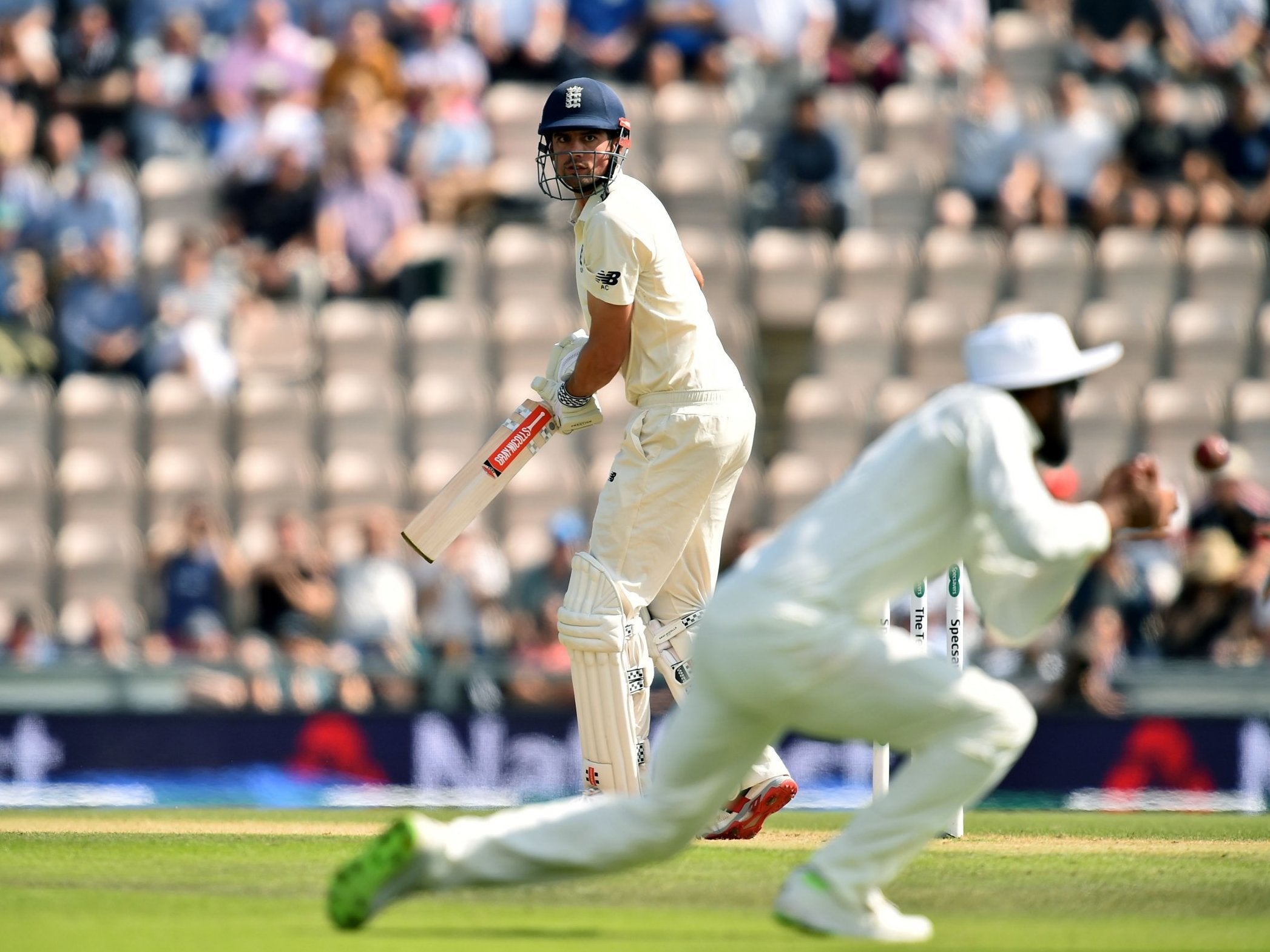 Alastair Cook looks back to see Jasprit Bumrah take the catch