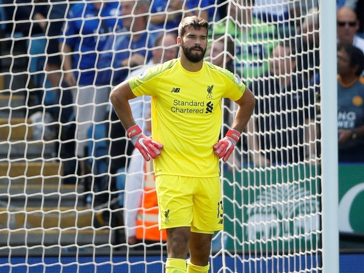 Liverpool’s Alisson looks dejected after Leicester City’s first goal